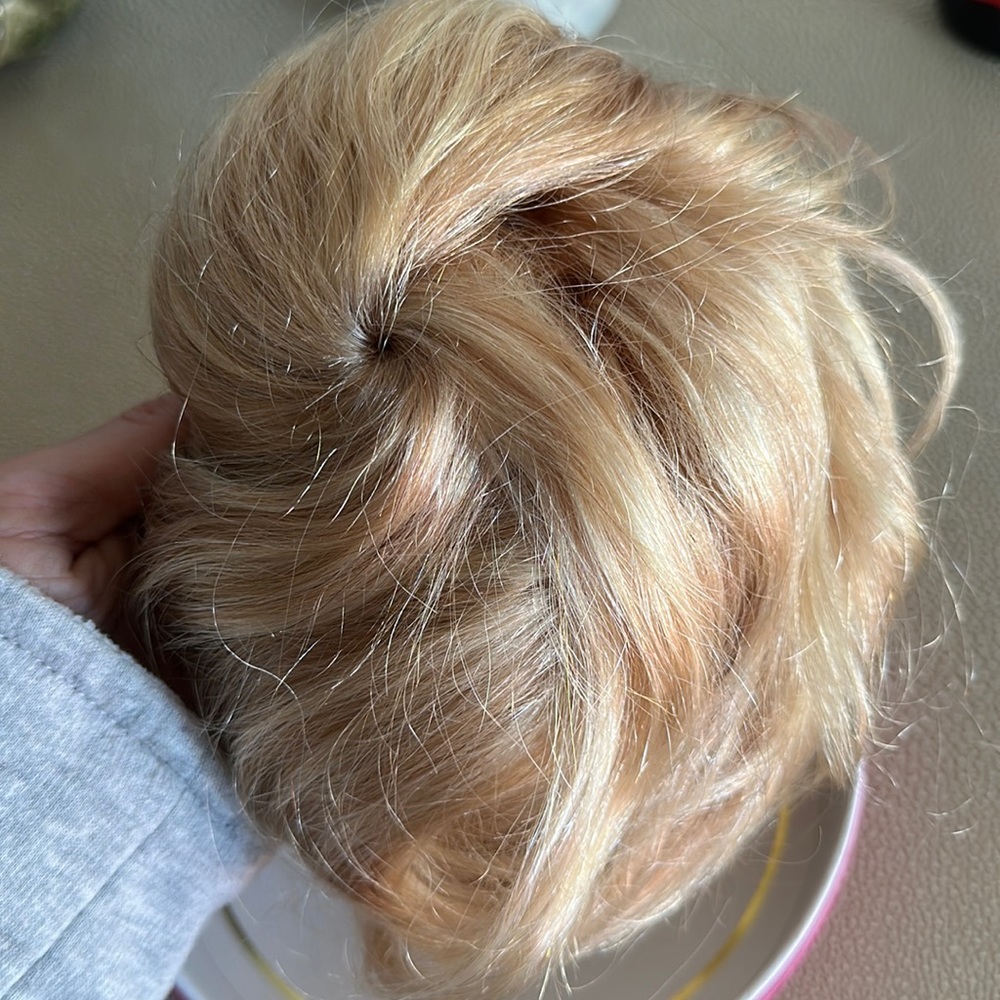Luxy real hair extensions clip in bun. Classic dirty blond color highlights.NWOT